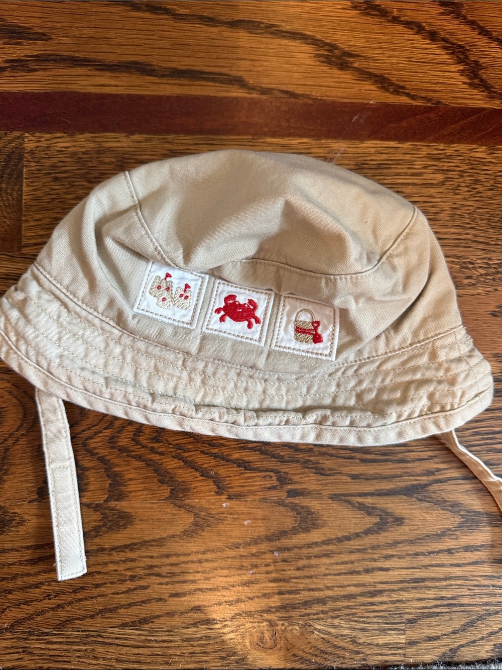 Janie and Jack Beige Bucket Hat with Red Embroidered Motifs